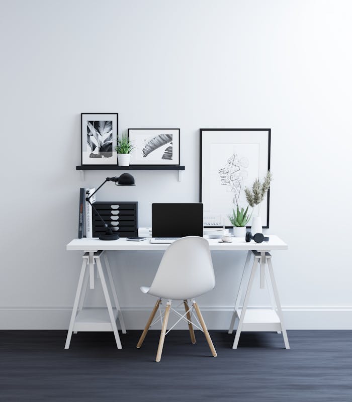 embark Clean, stylish home office space featuring a minimalist desk, laptop, and decor with a modern look.
